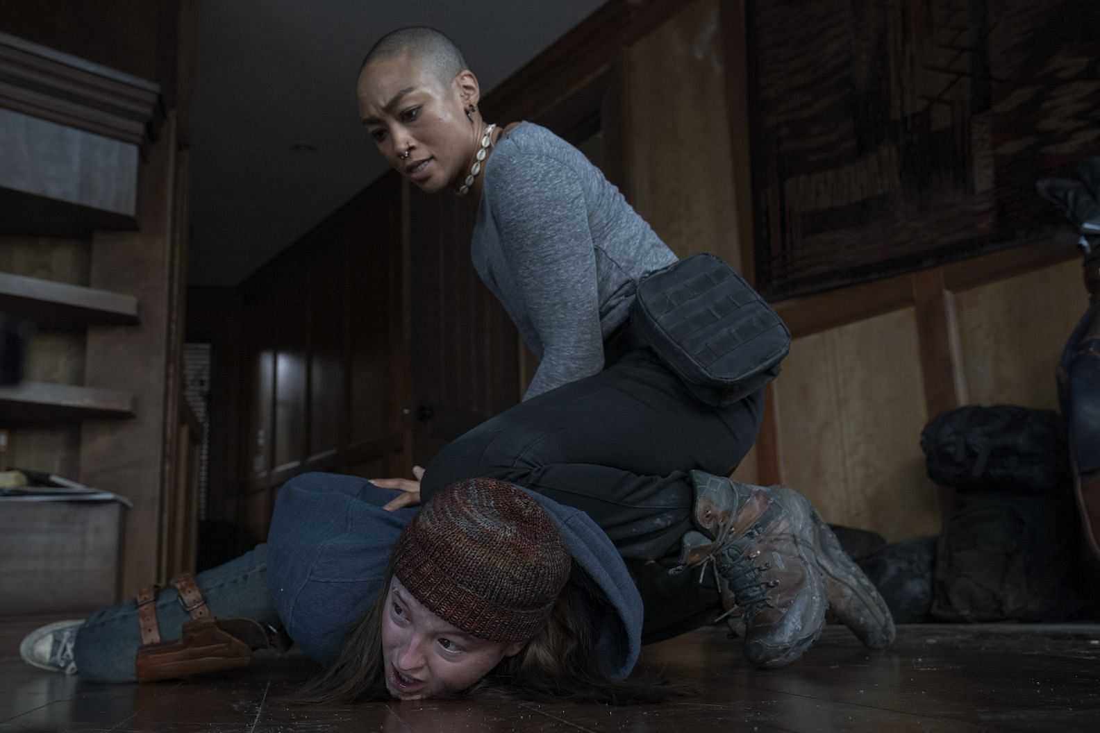 Nora holding down Ellie in The Last of Us season 2 (Image via HBO)